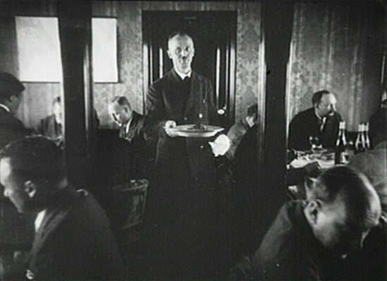 Heinrich Kubis serving a meal aboard LZ-127