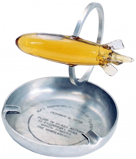 Each passenger was given a souvenir duralumin ashtray with a glass model of the airship filled with Esso diesel fuel